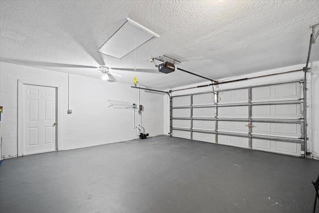 garage with ceiling fan and a garage door opener