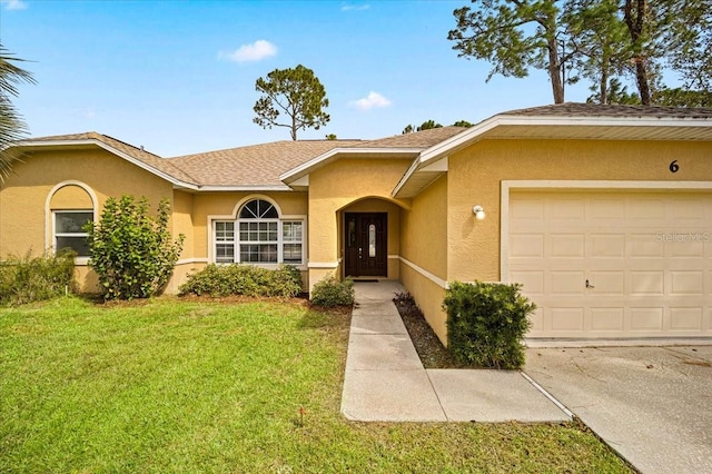 ranch-style home with a front lawn and a garage