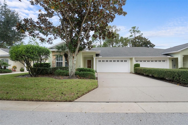 view of front of house with a front lawn and a garage