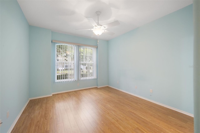 unfurnished room featuring light hardwood / wood-style floors and ceiling fan