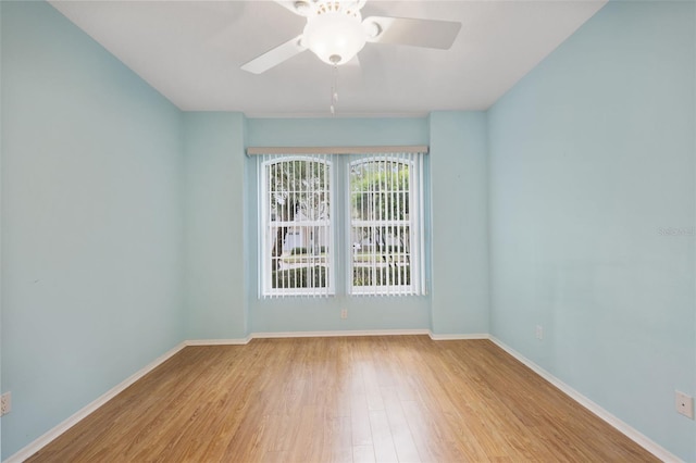 spare room featuring ceiling fan and light wood-type flooring