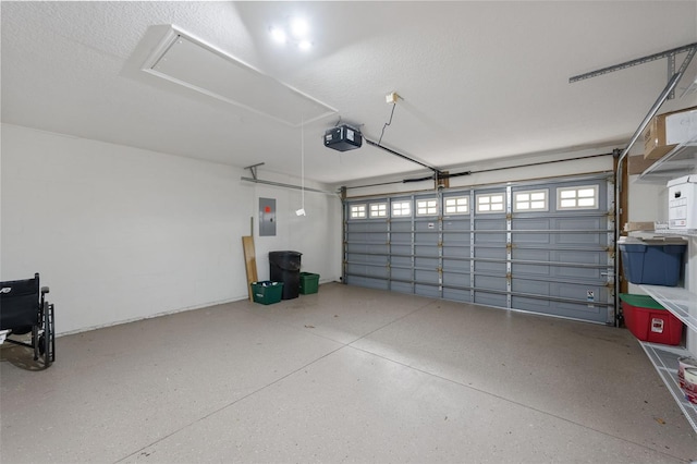 garage featuring a garage door opener and electric panel