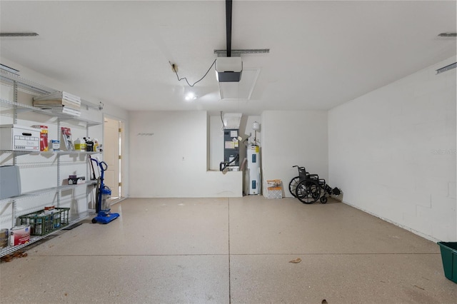 garage featuring a garage door opener, electric water heater, and heating unit