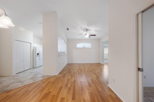 interior space with ceiling fan and light hardwood / wood-style flooring