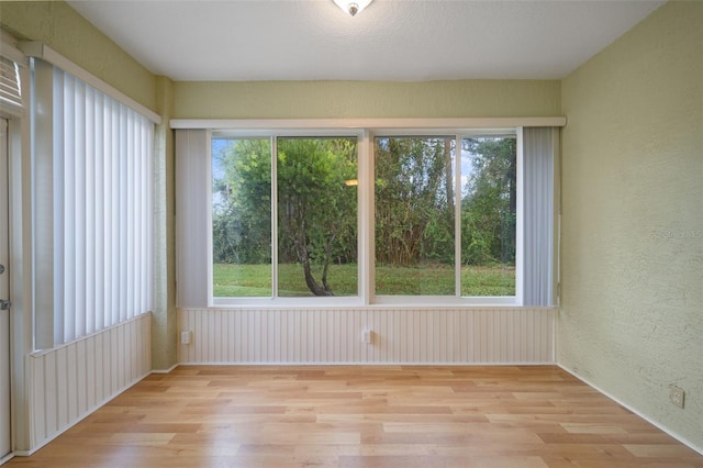 unfurnished sunroom featuring a healthy amount of sunlight