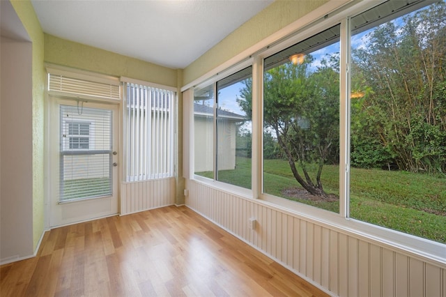 unfurnished sunroom with plenty of natural light