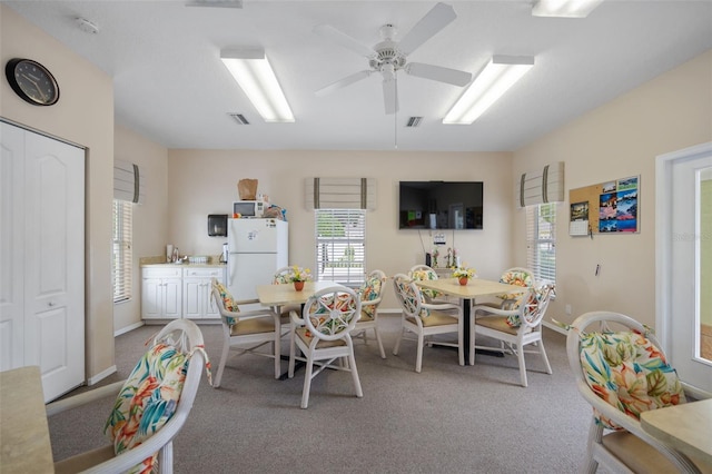 playroom featuring ceiling fan and light carpet