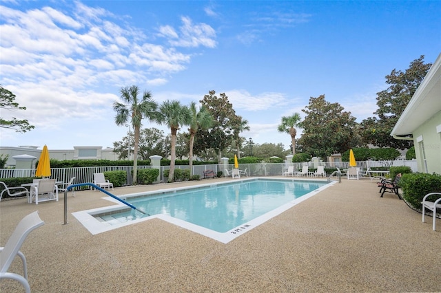 view of swimming pool with a patio