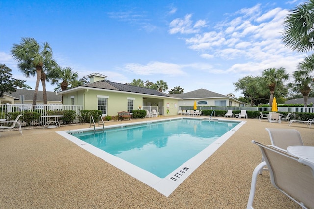 view of swimming pool with a patio area