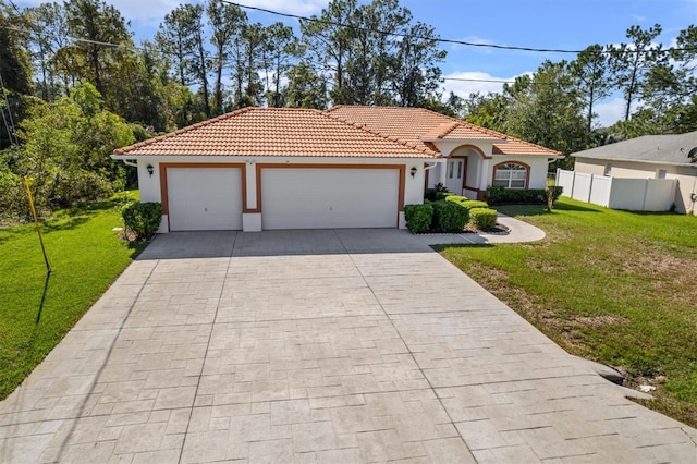 mediterranean / spanish-style house featuring a front yard and a garage