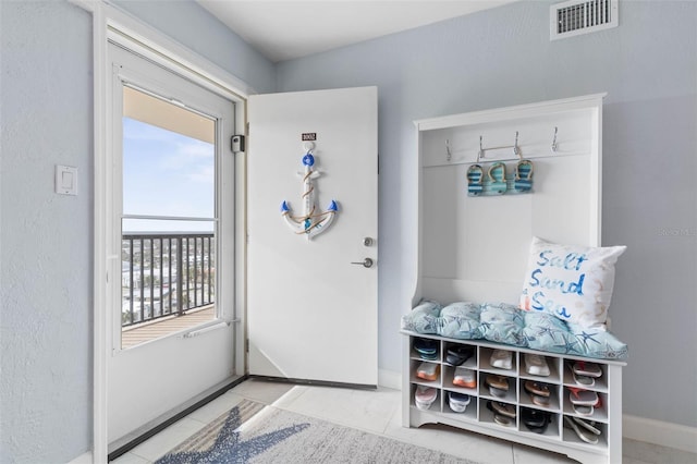 mudroom with light tile patterned flooring