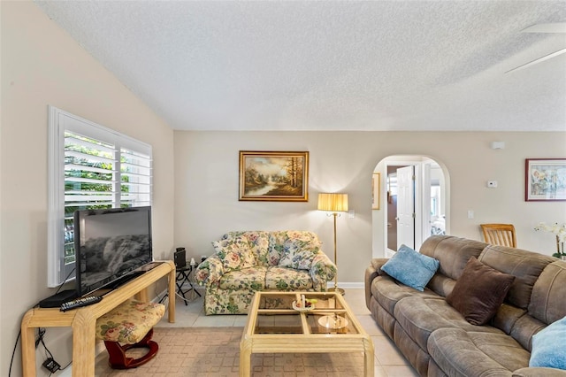 tiled living room with a textured ceiling