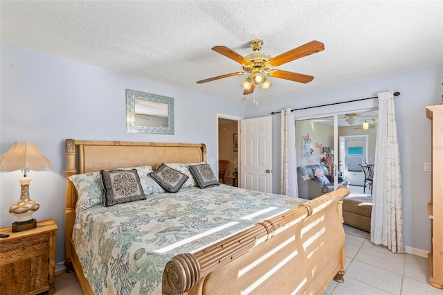 bedroom with a closet, a textured ceiling, light tile patterned flooring, and ceiling fan