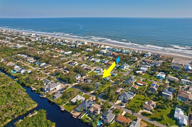 aerial view featuring a water view and a beach view