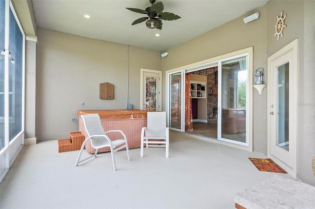 sunroom featuring a wealth of natural light and ceiling fan