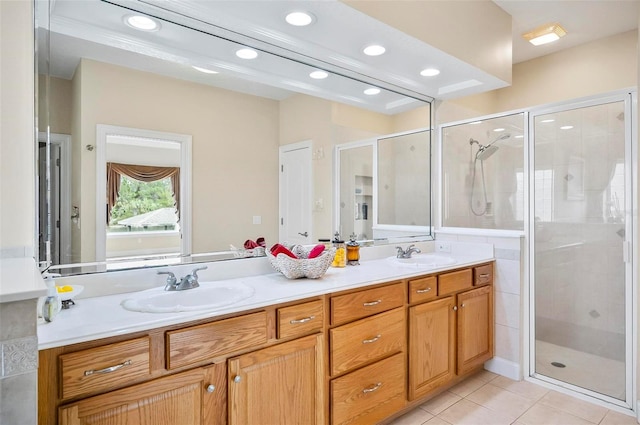 bathroom featuring vanity, tile patterned flooring, and an enclosed shower