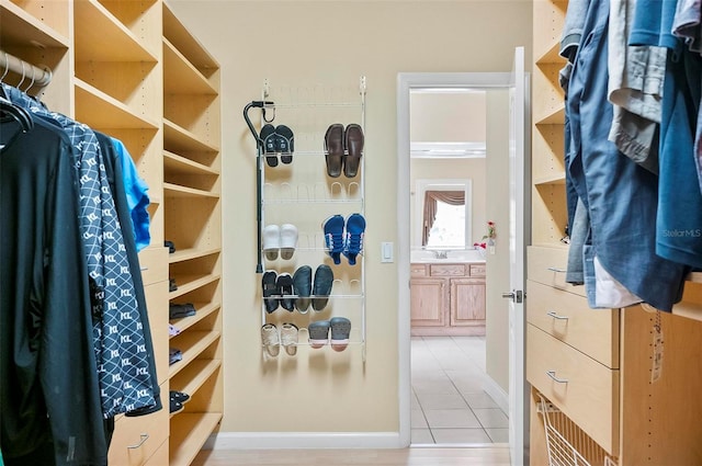 spacious closet with light tile patterned flooring