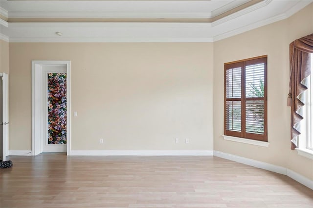 unfurnished room with light hardwood / wood-style flooring and ornamental molding