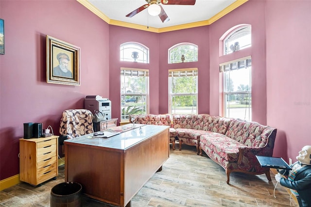 office with crown molding, wood-type flooring, and ceiling fan