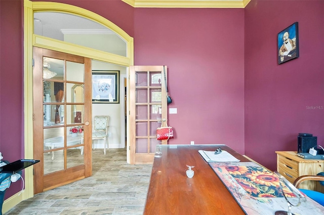 office area with french doors, light hardwood / wood-style floors, and ornamental molding