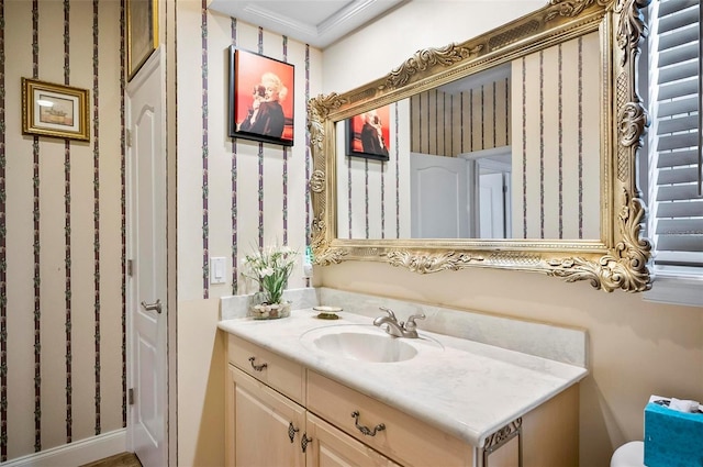 bathroom featuring vanity and crown molding