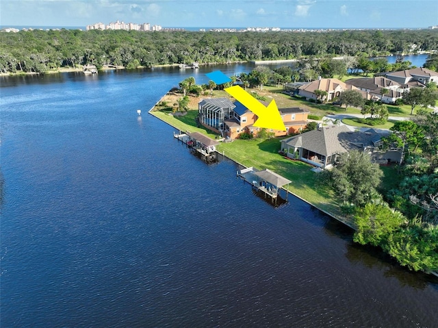 birds eye view of property with a water view