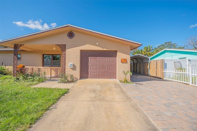 view of front of property with a garage