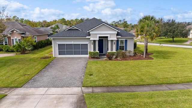 view of front of home featuring a front yard and a garage