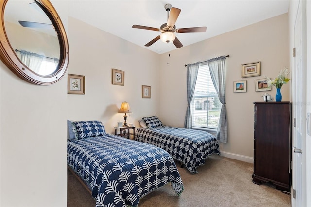 bedroom with light carpet and ceiling fan