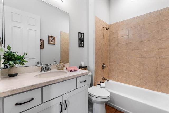 full bathroom featuring vanity, toilet, and tiled shower / bath