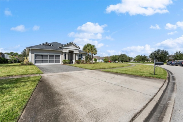 view of front of home featuring a front yard and a garage