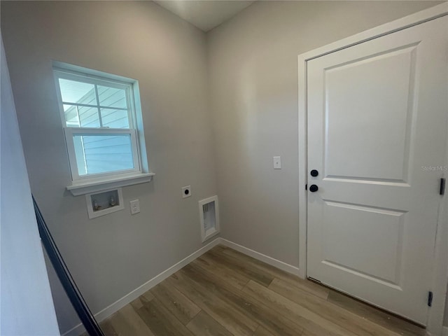 laundry area featuring hookup for a washing machine, hookup for an electric dryer, and light hardwood / wood-style flooring