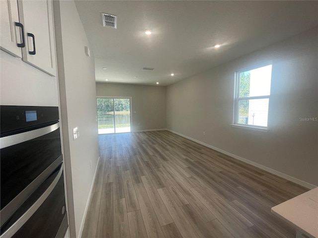 unfurnished room featuring hardwood / wood-style floors