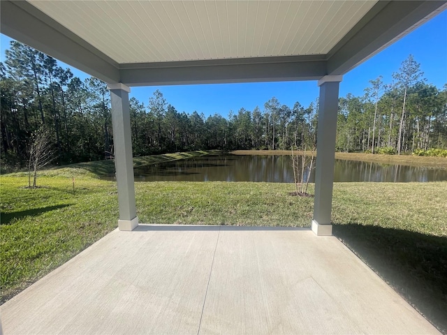 view of patio with a water view