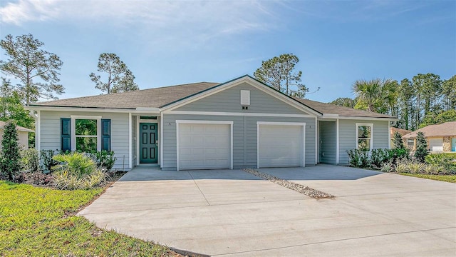 ranch-style house featuring a garage