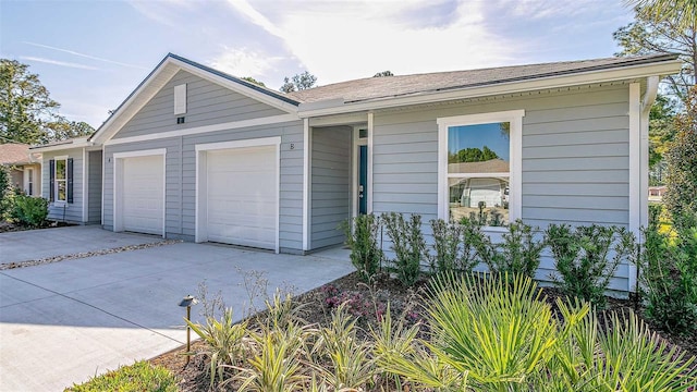 ranch-style home with a garage