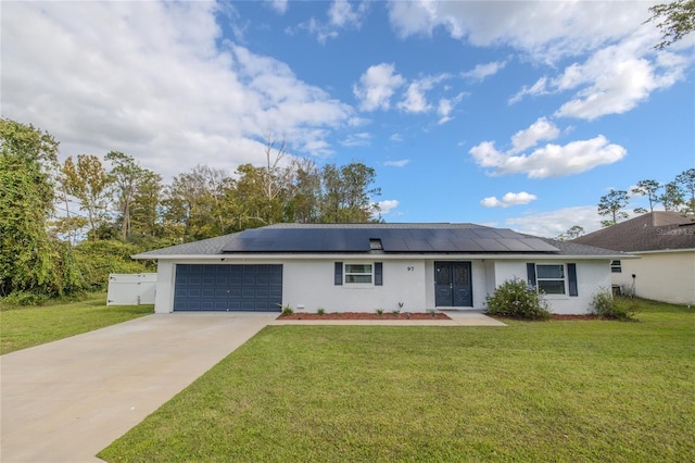 ranch-style home featuring solar panels, a front lawn, and a garage