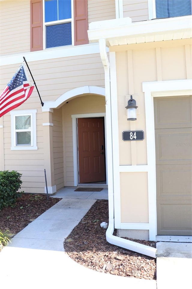 view of exterior entry featuring a garage