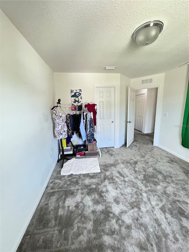 interior space featuring a textured ceiling