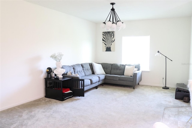 living room with a notable chandelier and light colored carpet