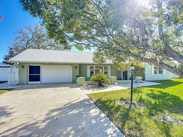 ranch-style home with a front yard and a garage