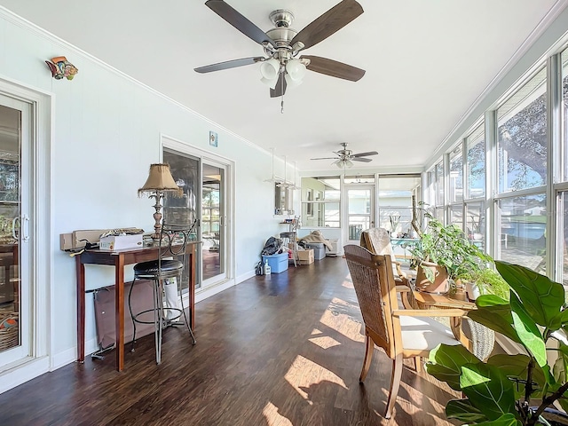 sunroom featuring ceiling fan