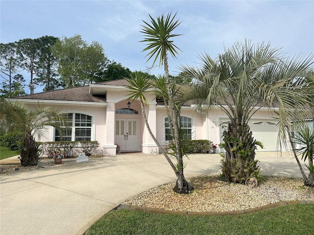 view of front of home featuring french doors and a garage