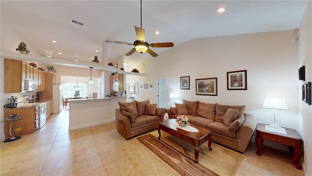 tiled living room with lofted ceiling and ceiling fan