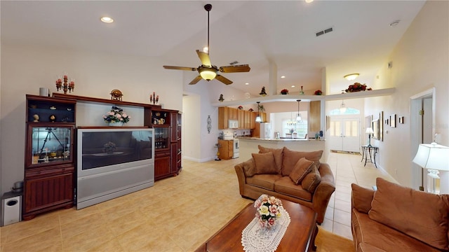 living room with high vaulted ceiling, light tile patterned floors, and ceiling fan