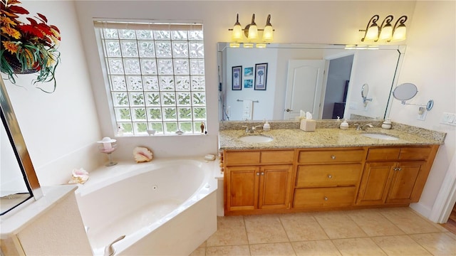 bathroom with vanity, tile patterned floors, and a bathing tub