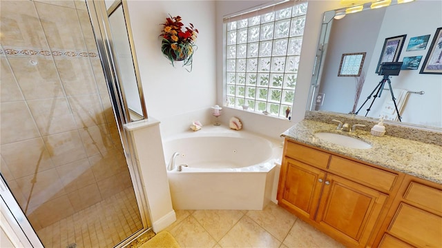 bathroom with vanity, shower with separate bathtub, and tile patterned flooring