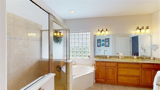 bathroom with vanity, independent shower and bath, and tile patterned flooring