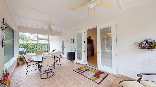 sunroom featuring ceiling fan