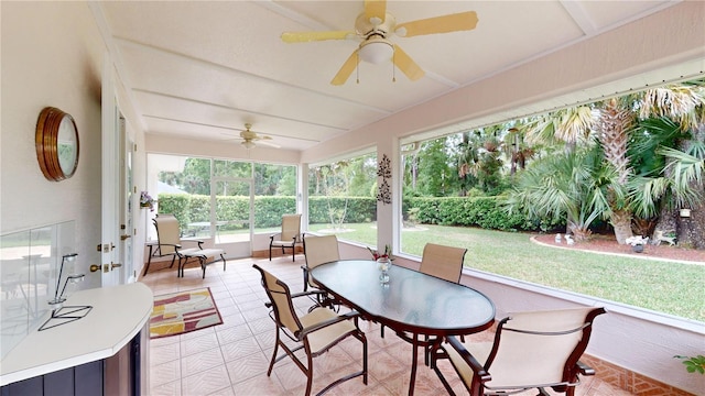 sunroom featuring ceiling fan